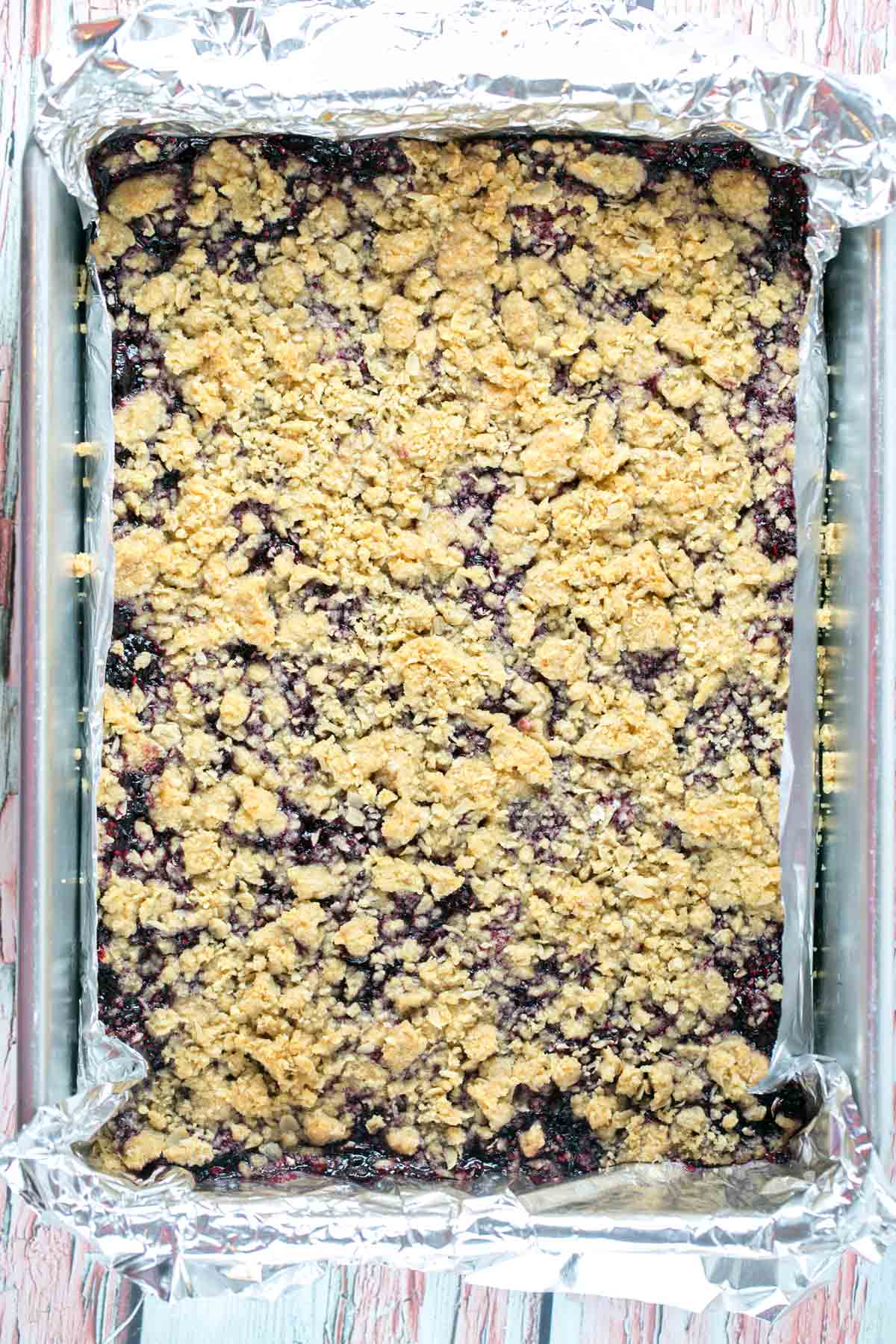 Berry Oatmeal Crumble Bars: a crisp oatmeal shell surrounding a sweet homemade berry jam - delicious with blueberries, blackberries, raspberries, or strawberries! {Bunsen Burner Bakery} #berries #jambars #summerdesserts #oatmealbars #baking