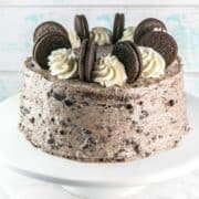 Chocolate Oreo Layer Cake: a rich buttermilk chocolate cake, dotted with chocolate chips and sandwiched between thick layers of Oreo cream cheese frosting. {Bunsen Burner Bakery} #cake #chocolatecake #creamcheesefrosting #oreocake