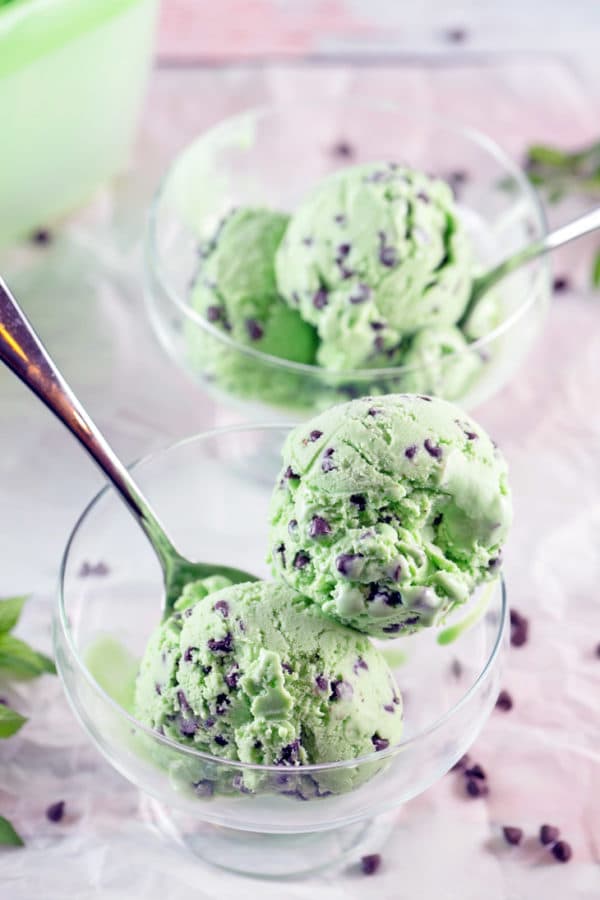green mint chocolate chip ice cream in a bowl with a spoon