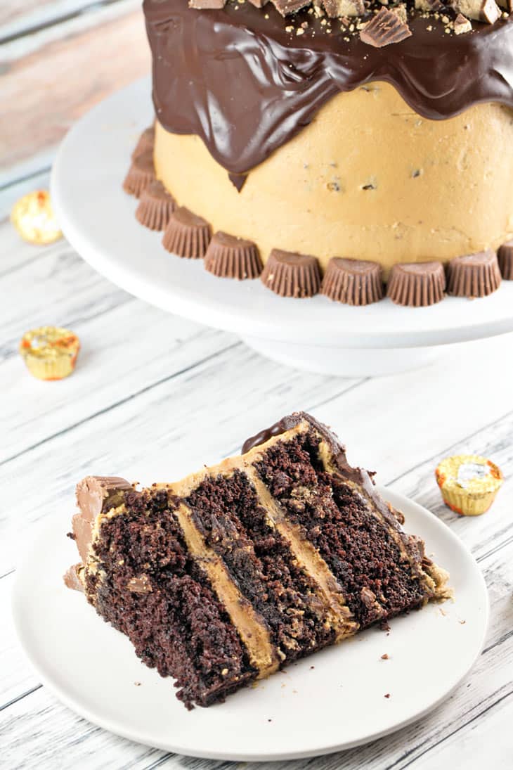 Chocolate Peanut Butter Cup Cake: Chocolate cake, peanut butter frosting, chocolate ganache, peanut butter cups. This Peanut Butter Cup Cake is a chocolate and peanut butter lover's dream. {Bunsen Burner Bakery}