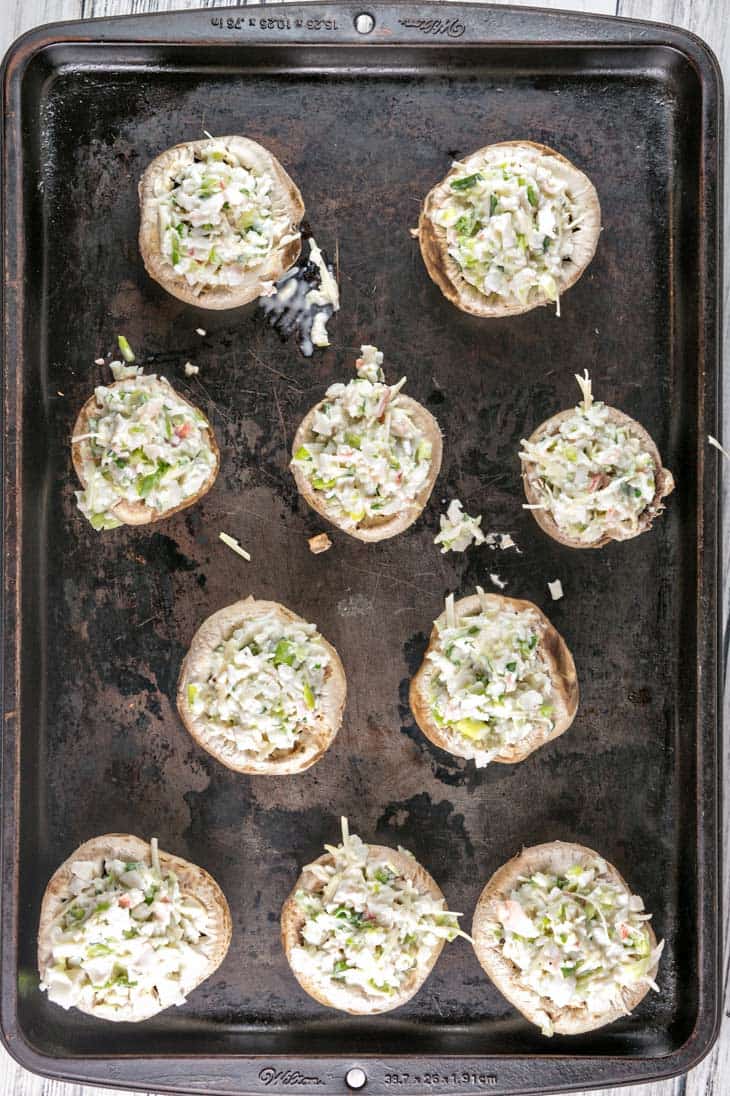 Crab Stuffed Mushrooms: perfect on the grill or baked in the oven, these make-ahead crab stuffed mushrooms are a perfect side or appetizer for your next party. No breadcrumb filler means they're gluten free, too! {Bunsen Burner Bakery}