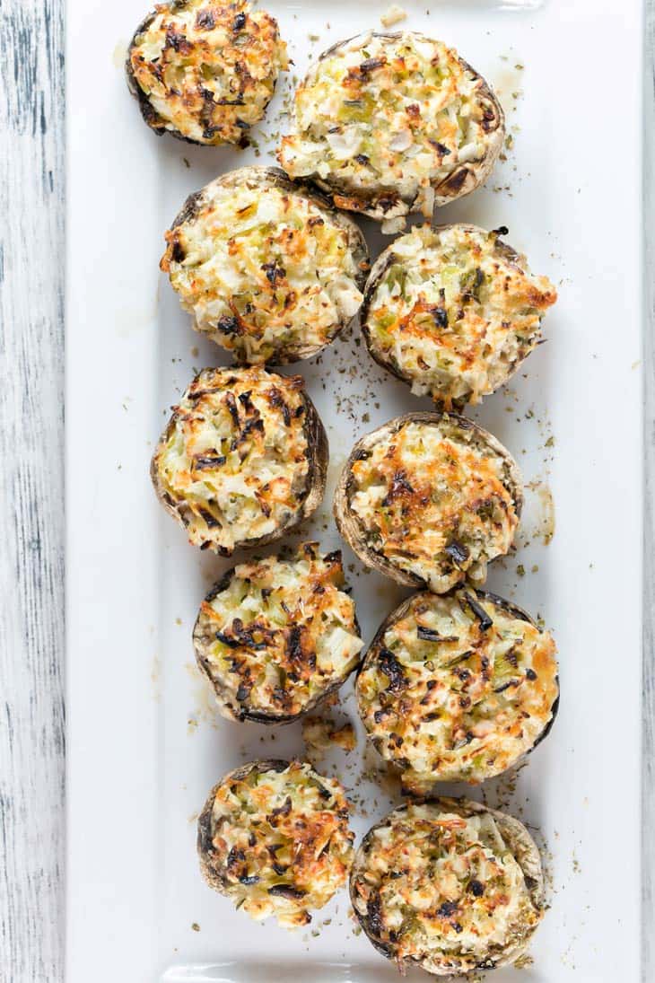 Crab Stuffed Mushrooms: perfect on the grill or baked in the oven, these make-ahead crab stuffed mushrooms are a perfect side or appetizer for your next party. No breadcrumb filler means they're gluten free, too! {Bunsen Burner Bakery}