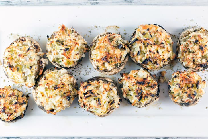 Crab Stuffed Mushrooms: perfect on the grill or baked in the oven, these make-ahead crab stuffed mushrooms are a perfect side or appetizer for your next party. No breadcrumb filler means they're gluten free, too! {Bunsen Burner Bakery}