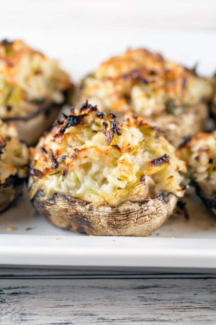 Crab Stuffed Mushrooms: perfect on the grill or baked in the oven, these make-ahead crab stuffed mushrooms are a perfect side or appetizer for your next party. No breadcrumb filler means they're gluten free, too! {Bunsen Burner Bakery}