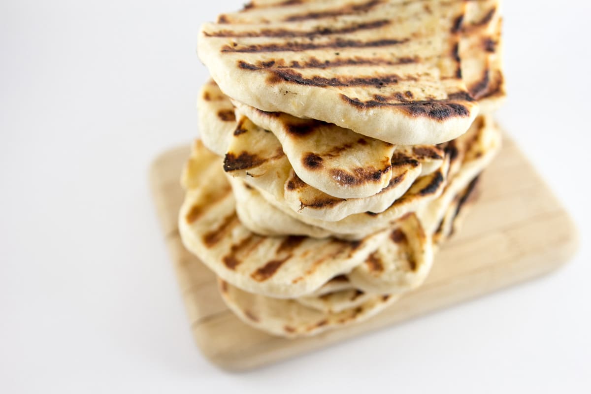 Garlic Naan: homemade naan is so much easier than you think!  Soft, slightly chewy, and flavored with garlic, make a big batch and freeze the rest for later. {Bunsen Burner Bakery}