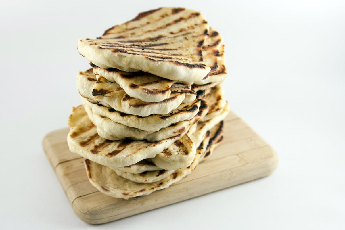 Garlic Naan: homemade naan is so much easier than you think!  Soft, slightly chewy, and flavored with garlic, make a big batch and freeze the rest for later. {Bunsen Burner Bakery}