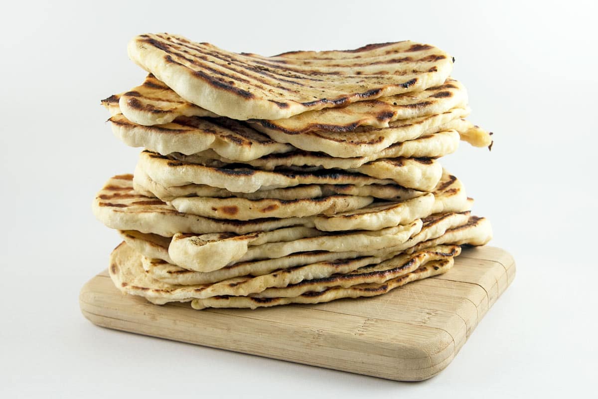 Garlic Naan: homemade naan is so much easier than you think!  Soft, slightly chewy, and flavored with garlic, make a big batch and freeze the rest for later. {Bunsen Burner Bakery}