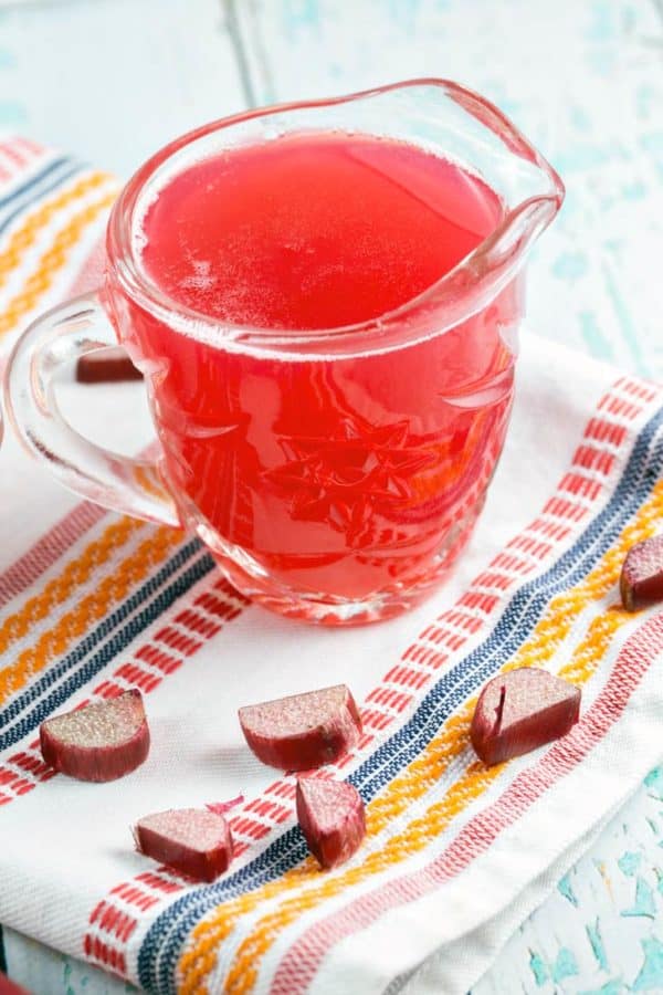 Rhubarb Simple Syrup: turn your extra rhubarb into a brilliantly red and delightfully sweet-tart rhubarb simple syrup. Perfect for topping ice cream, poke cakes, flavoring lemonades and yogurt, and of course, making rhubarb cocktails! {Bunsen Burner Bakery} #rhubarb #simplesyrup #spring #cocktails