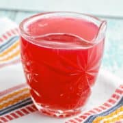 Rhubarb Simple Syrup: turn your extra rhubarb into a brilliantly red and delightfully sweet-tart rhubarb simple syrup. Perfect for topping ice cream, poke cakes, flavoring lemonades and yogurt, and of course, making rhubarb cocktails! {Bunsen Burner Bakery} #rhubarb #simplesyrup #spring #cocktails