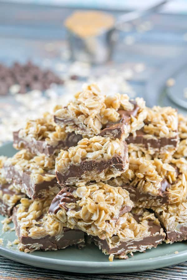 a pile of gluten free peanut butter oatmeal bars stacked on a plate