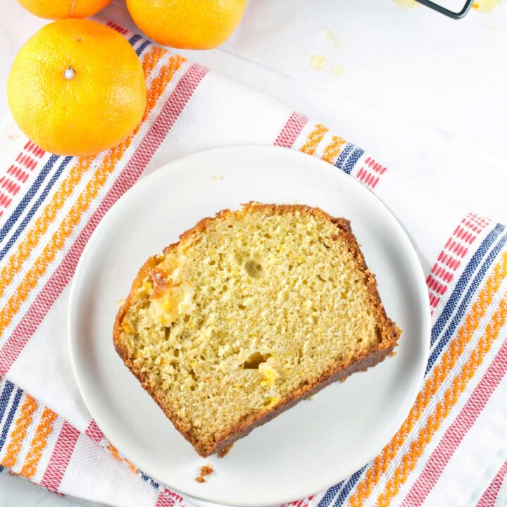 slice of quick bread with vanilla and clementines on a dessert plate