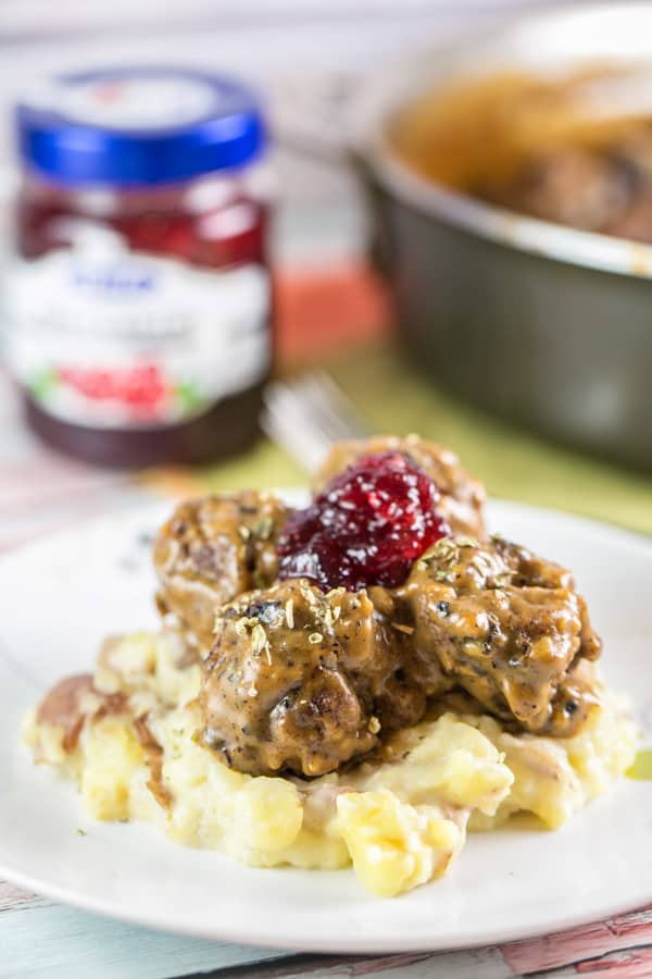 Swedish Meatballs: The ultimate comfort food. Homemade meatballs with thick gravy and lingonberry jam, served over egg noodles or mashed potatoes. {Bunsen Burner Bakery} #swedishmeatballs #dinner #meatballs