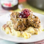 Swedish Meatballs: The ultimate comfort food. Homemade meatballs with thick gravy and lingonberry jam, served over egg noodles or mashed potatoes. {Bunsen Burner Bakery} #swedishmeatballs #dinner #meatballs