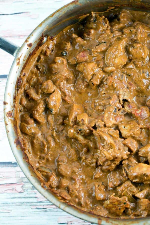 overhead photo of a large sautee pan full of chicken tikka masala