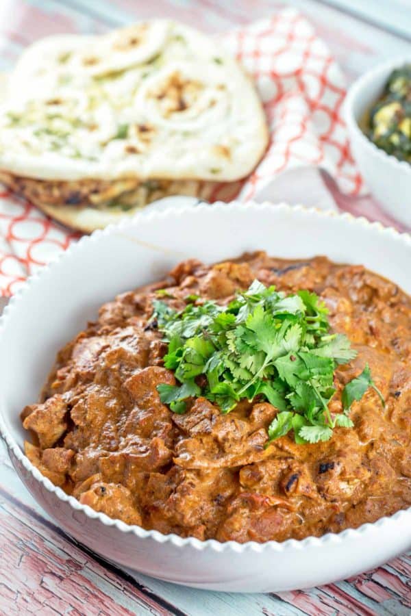 a large bowl of flavorful chicken tikka masala prepared in the slow cooker