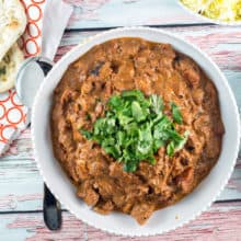 Chicken Tikka Masala: Warm up from the cold with this easy, flavorful chicken tikka masala, adaptable for either the stovetop or crockpot. #bunsenburnerbakery #chickentikkamasala #slowcooker #homemadeindian #glutenfree