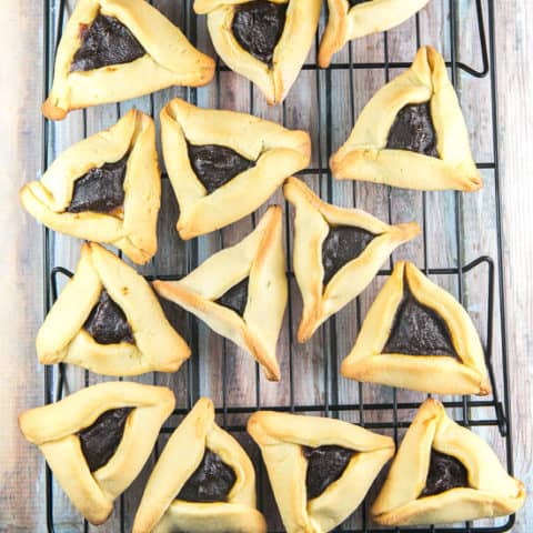 Traditional Homemade Hamantaschen Recipe: Making your own homemade hamantaschen is easy! Learn how with this simple dough recipe and all the tips you need for perfectly shaped hamantaschen without spilled filling! #bunsenburnerbakery #purim #hamantaschen #cookies