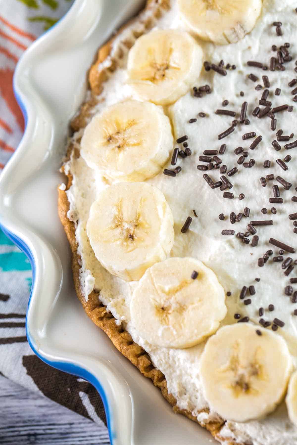 Old Fashioned Banana Cream Pie: A traditional, homemade diner-style pie - banana-infused pastry cream, sliced fresh bananas, and sky-high whipped cream. {bunseburnerbakery.com} #pie #bananacreampie