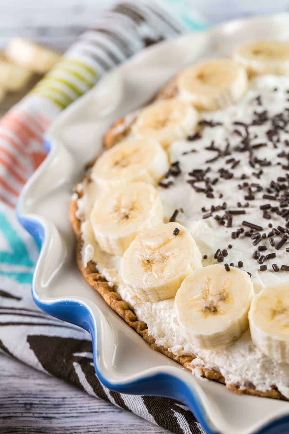 Old Fashioned Banana Cream Pie: A traditional, homemade diner-style pie - banana-infused pastry cream, sliced fresh bananas, and sky-high whipped cream. {bunseburnerbakery.com} #pie #bananacreampie