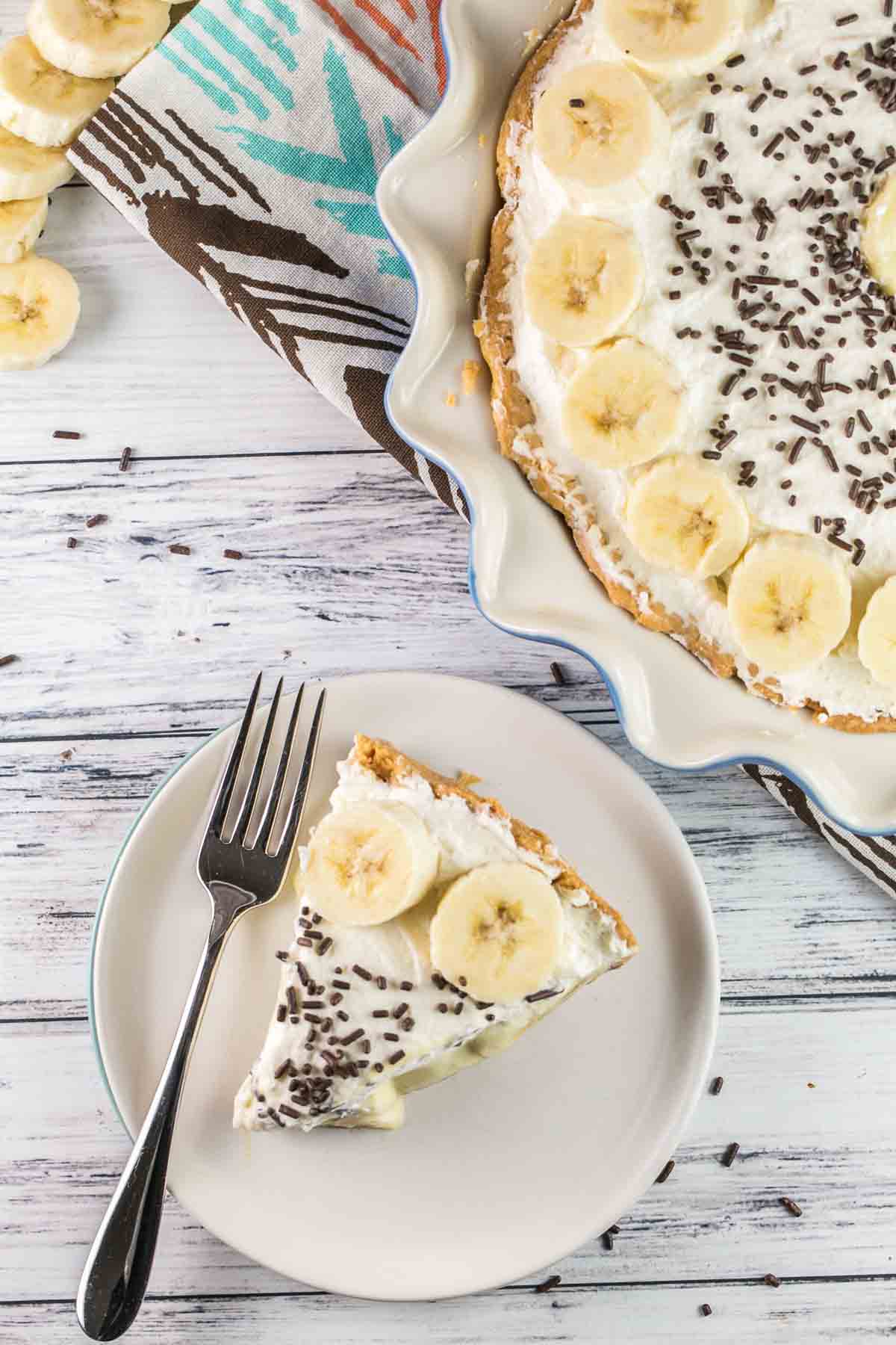 Old Fashioned Banana Cream Pie: A traditional, homemade diner-style pie - banana-infused pastry cream, sliced fresh bananas, and sky-high whipped cream. {bunseburnerbakery.com} #pie #bananacreampie