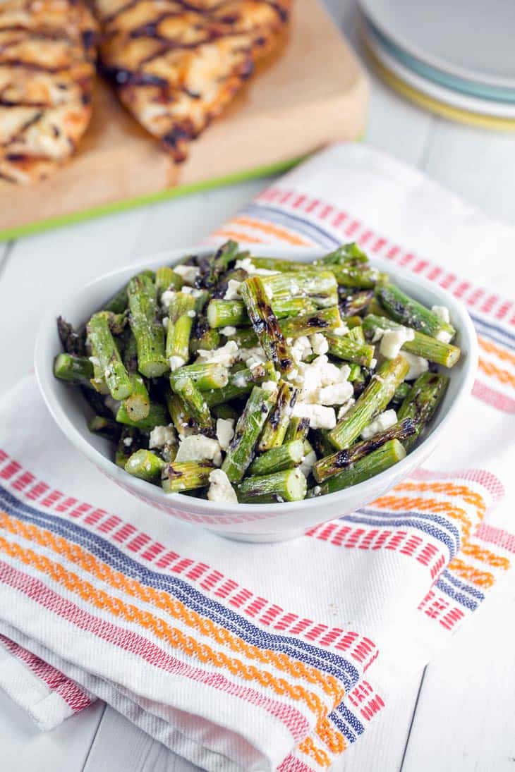 Grilled asparagus, tangy feta cheese, and a splash of lemon juice — grilled asparagus and feta salad is the perfect quick and easy early summer salad. {Bunsen Burner Bakery}