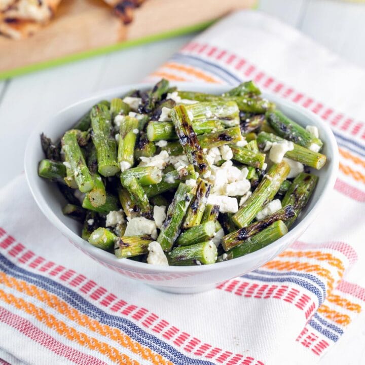 grilled asparagus salad in a white bowl