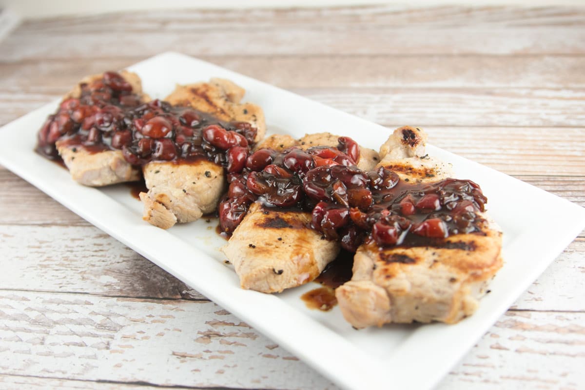 Pan-Grilled Pork Chops with Sour Cherry Sauce: perfectly brined pork chops with a delicious sweet and sour sauce. {Bunsen Burner Bakery}