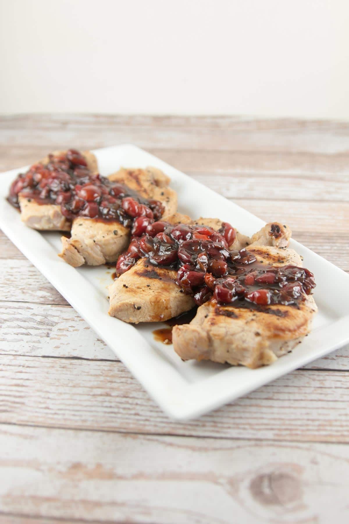 Pan-Grilled Pork Chops with Sour Cherry Sauce: perfectly brined pork chops with a delicious sweet and sour sauce. {Bunsen Burner Bakery}