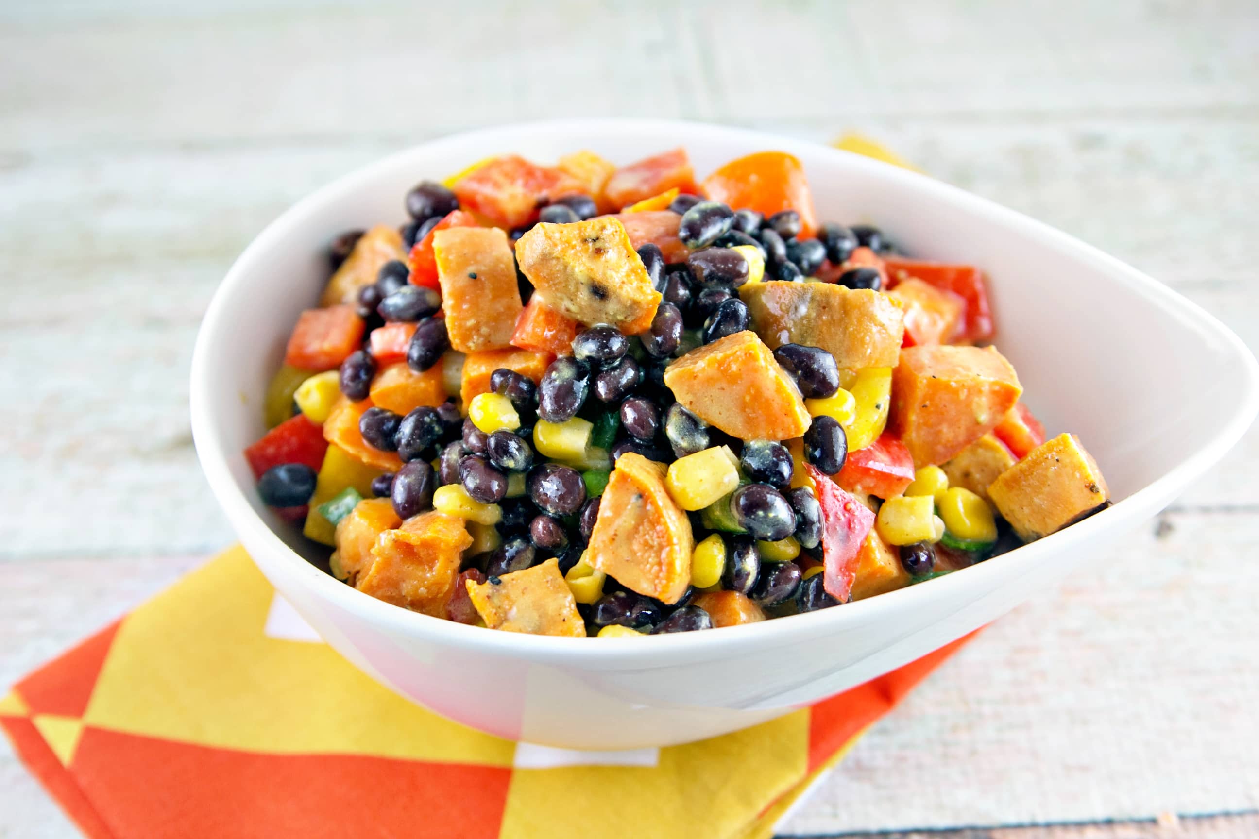 Sweet Potato Black Bean Salad: the best salad of summer. Buttery sweet potatoes, crunchy peppers, tangy mustard-lime dressing. {Bunsen Burner Bakery}