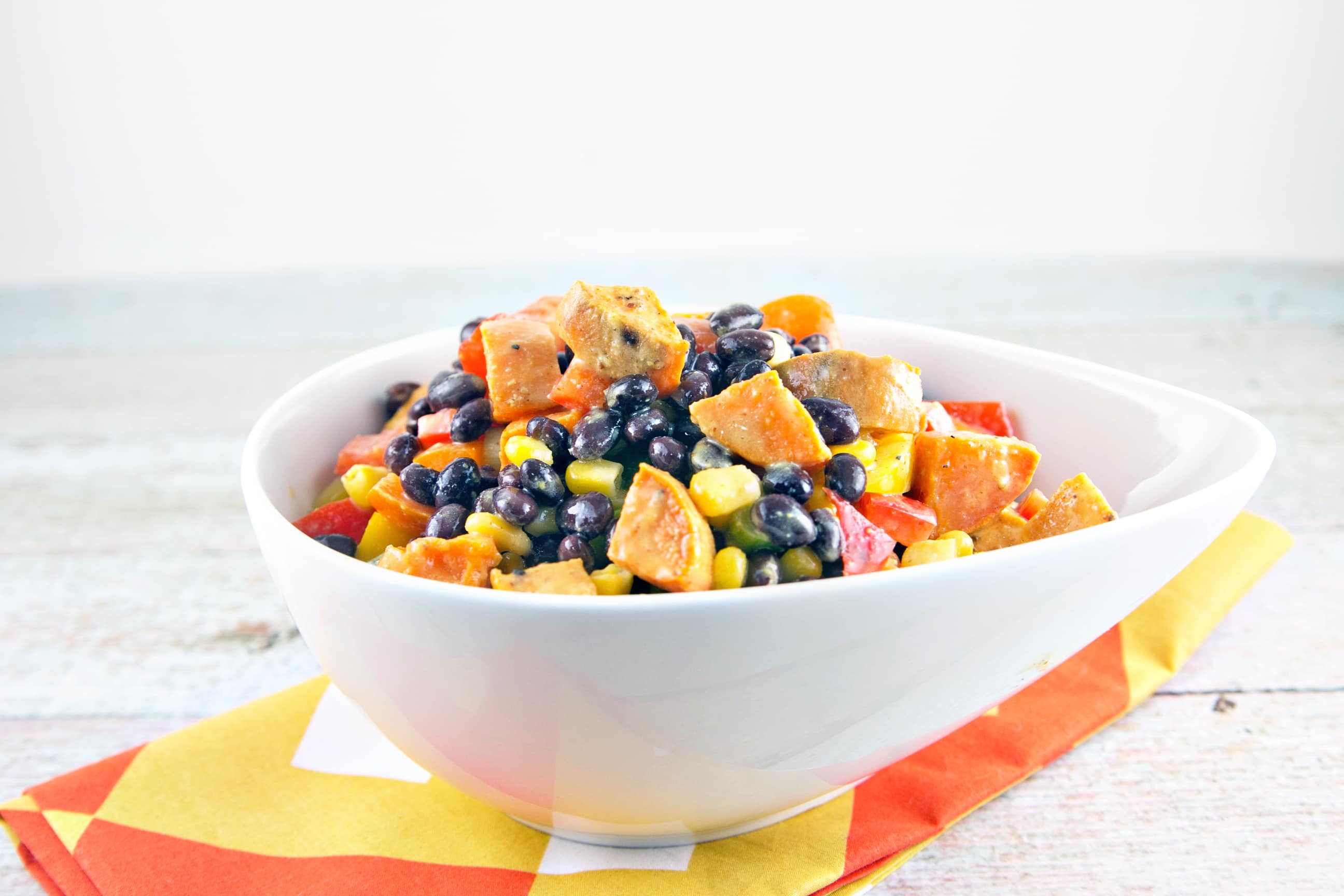 Sweet Potato Black Bean Salad: the best salad of summer. Buttery sweet potatoes, crunchy peppers, tangy mustard-lime dressing. {Bunsen Burner Bakery}