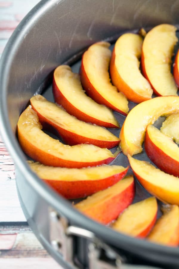 slices of nectarines arranged in a springform pan