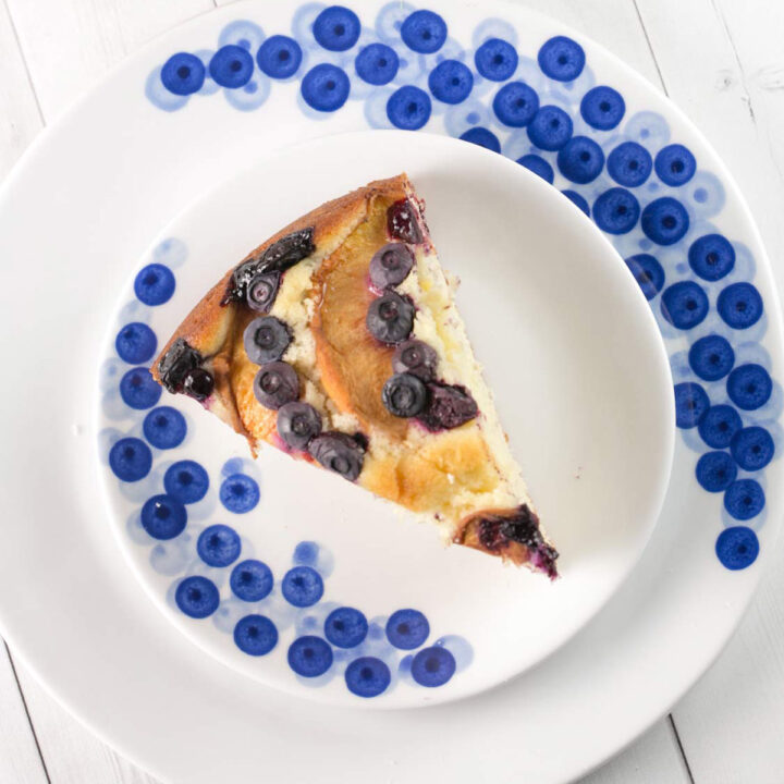 slice of blueberry peach coffee cake on decorative dessert plates