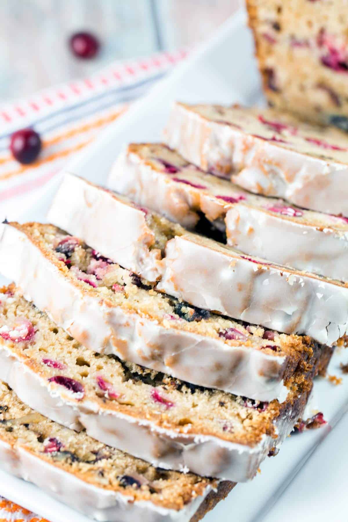 close up photo of slices of cranberry cider quick bread