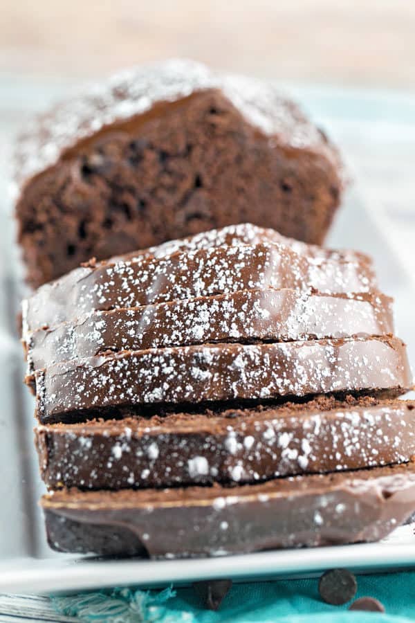 sliced chocolate buttermilk bread covered with thick glaze and dusting of powdered sugar