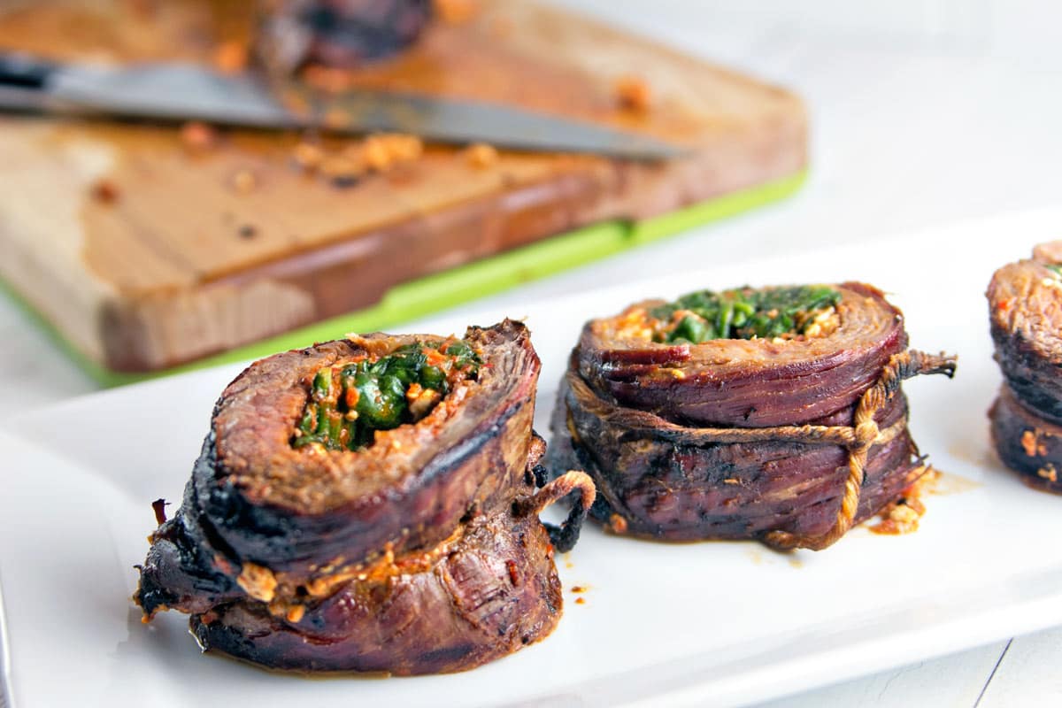 Roasted Red Pepper Stuffed Flank Steak: Stuck in a grilling rut? Shake things up with the bold, bright flavors of a Mediterranean-inspired stuffed flank steak, starring roasted red pepper pesto, feta, and spinach. #ad https://ooh.li/21ca3ca