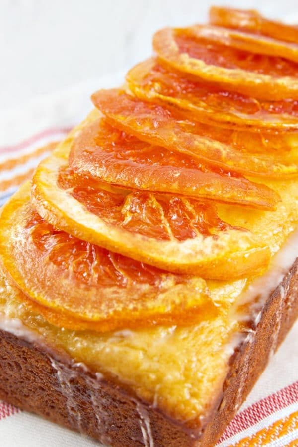 Candied Grapefruit Quick Bread: Yogurt quick bread loaded with grapefruit juice and zest, then topped with sugary grapefruit glaze and candied grapefruit. The ultimate grapefruit bread! {Bunsen Burner Bakery}