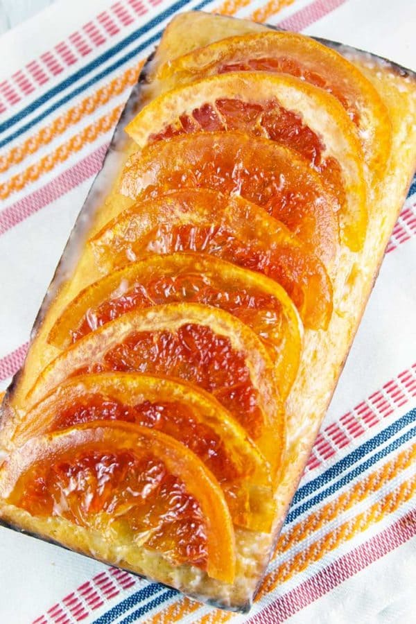 Candied Grapefruit Quick Bread: Yogurt quick bread loaded with grapefruit juice and zest, then topped with sugary grapefruit glaze and candied grapefruit. The ultimate grapefruit bread! {Bunsen Burner Bakery}