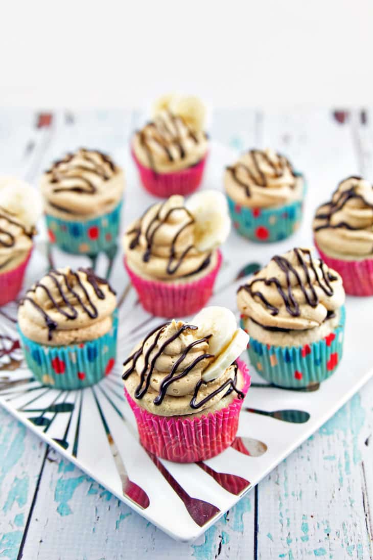 Peanut Butter Banana Cupcakes: Banana cupcakes filled with chocolate ganache and covered with fluffy peanut butter buttercream frosting. {Bunsen Burner Bakery}