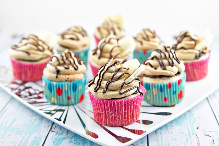 Peanut Butter Banana Cupcakes: Banana cupcakes filled with chocolate ganache and covered with fluffy peanut butter buttercream frosting. {Bunsen Burner Bakery}