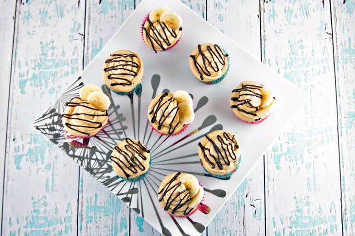 Peanut Butter Banana Cupcakes: Banana cupcakes filled with chocolate ganache and covered with fluffy peanut butter buttercream frosting. {Bunsen Burner Bakery}