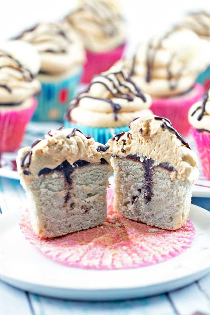 Peanut Butter Banana Cupcakes: Banana cupcakes filled with chocolate ganache and covered with fluffy peanut butter buttercream frosting. {Bunsen Burner Bakery}