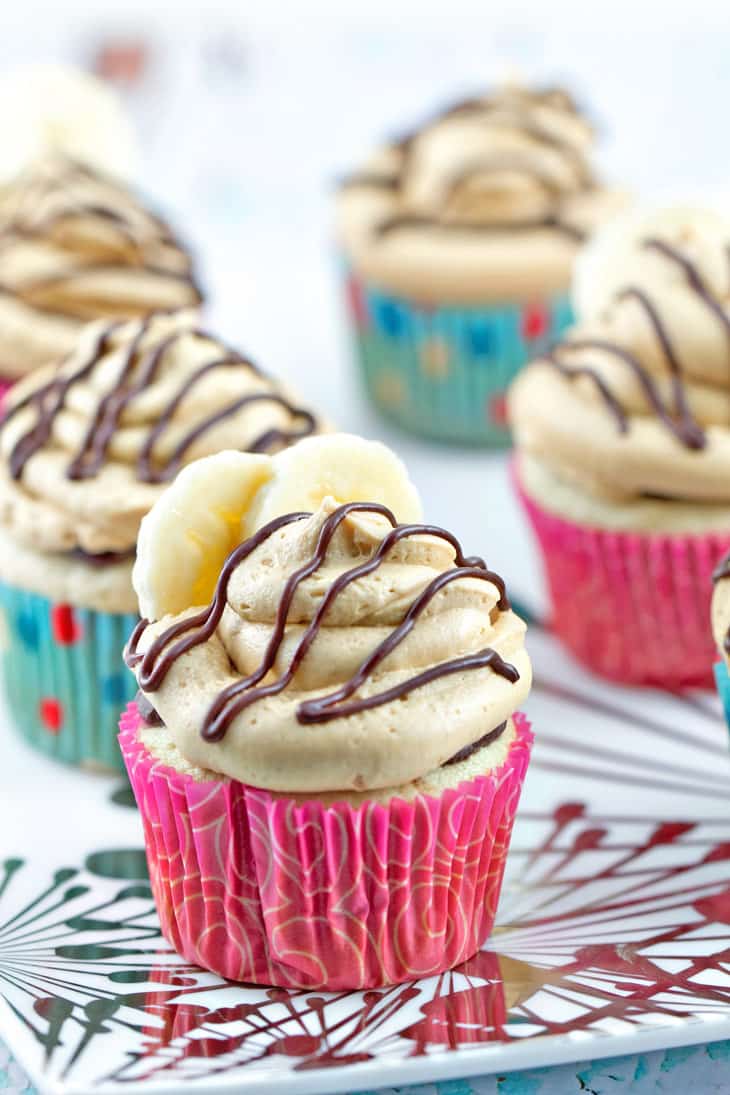 Peanut Butter Banana Cupcakes: Banana cupcakes filled with chocolate ganache and covered with fluffy peanut butter buttercream frosting. {Bunsen Burner Bakery}