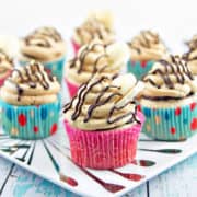 Peanut Butter Banana Cupcakes: Banana cupcakes filled with chocolate ganache and covered with fluffy peanut butter buttercream frosting. {Bunsen Burner Bakery}