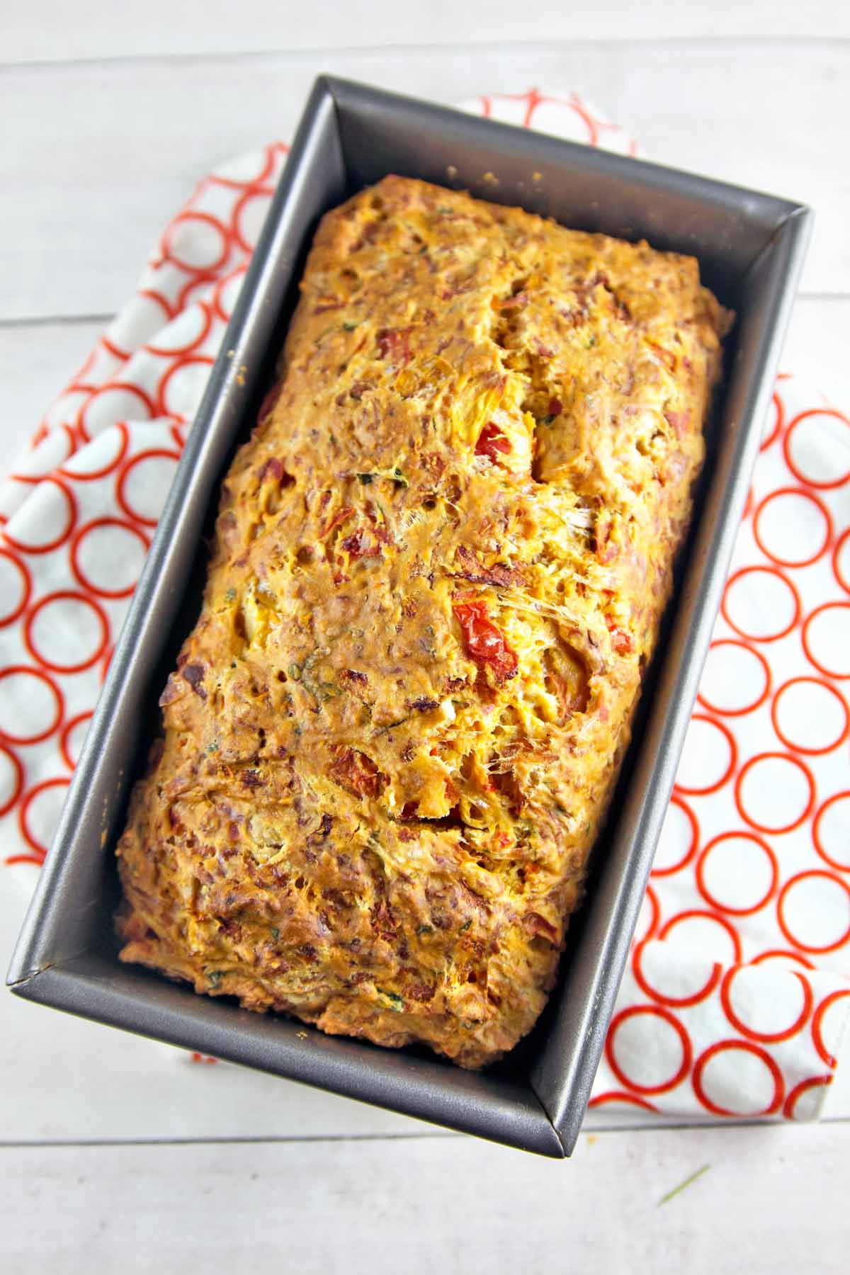Italian Herb Tomato Bread: an easy savory quick bread starring fresh tomatoes, Italian herbs, garlic, and cheese. Bake up some summer right in your kitchen! {Bunsen Burner Bakery}