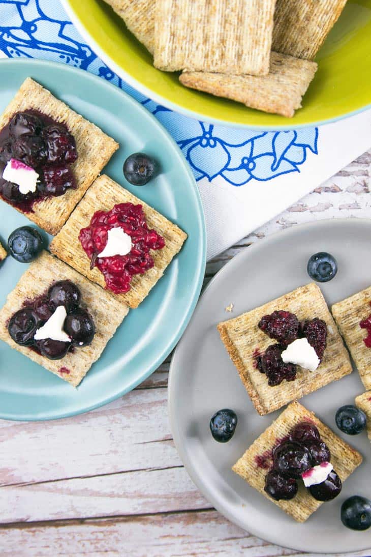 TriBerryTriscuits (Triple Berry Herb Cracker Bites): The perfect summer entertaining appetizer bites -- easy homemade berry compote paired with fresh herbs, TRISCUIT crackers, and a dollop of honey goat cheese. {Bunsen Burner Bakery}