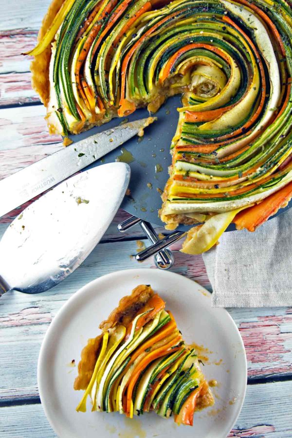 Thinly sliced summer vegetables are the visual star of this spiral vegetable tart. With a layer of homemade sundried tomato pesto and a flaky pie crust, this tart is as delicious as it is beautiful. {Bunsen Burner Bakery}