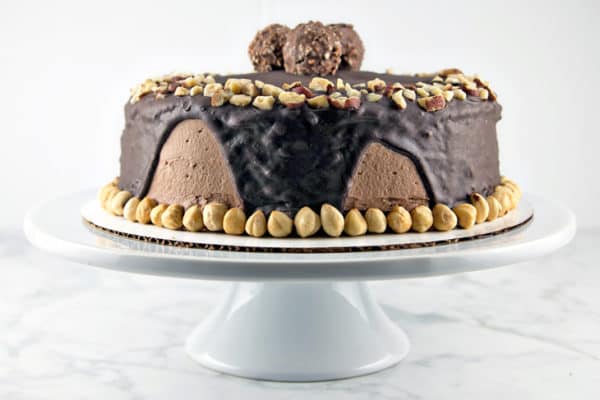 Chocolate Hazelnut Cake: two layers of rich chocolate cake, sandwiched between layers of fluffy Nutella buttercream, topped with chocolate ganache and chopped hazelnuts.  {Bunsen Burner Bakery}