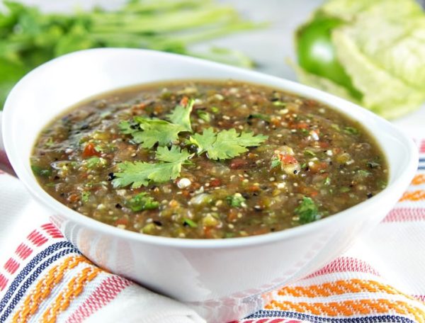 homemade roasted tomatillo salsa verde in a white bowl