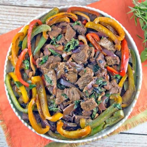 Thai Basil Beef: thinly sliced beef, bell peppers, and Thai basil combine in this fast, flavorful stir fry. Make your own Thai takeout in under 15 minutes! #bunsenburnerbakery #thaifood #glutenfree #stirfry #beefstirfry