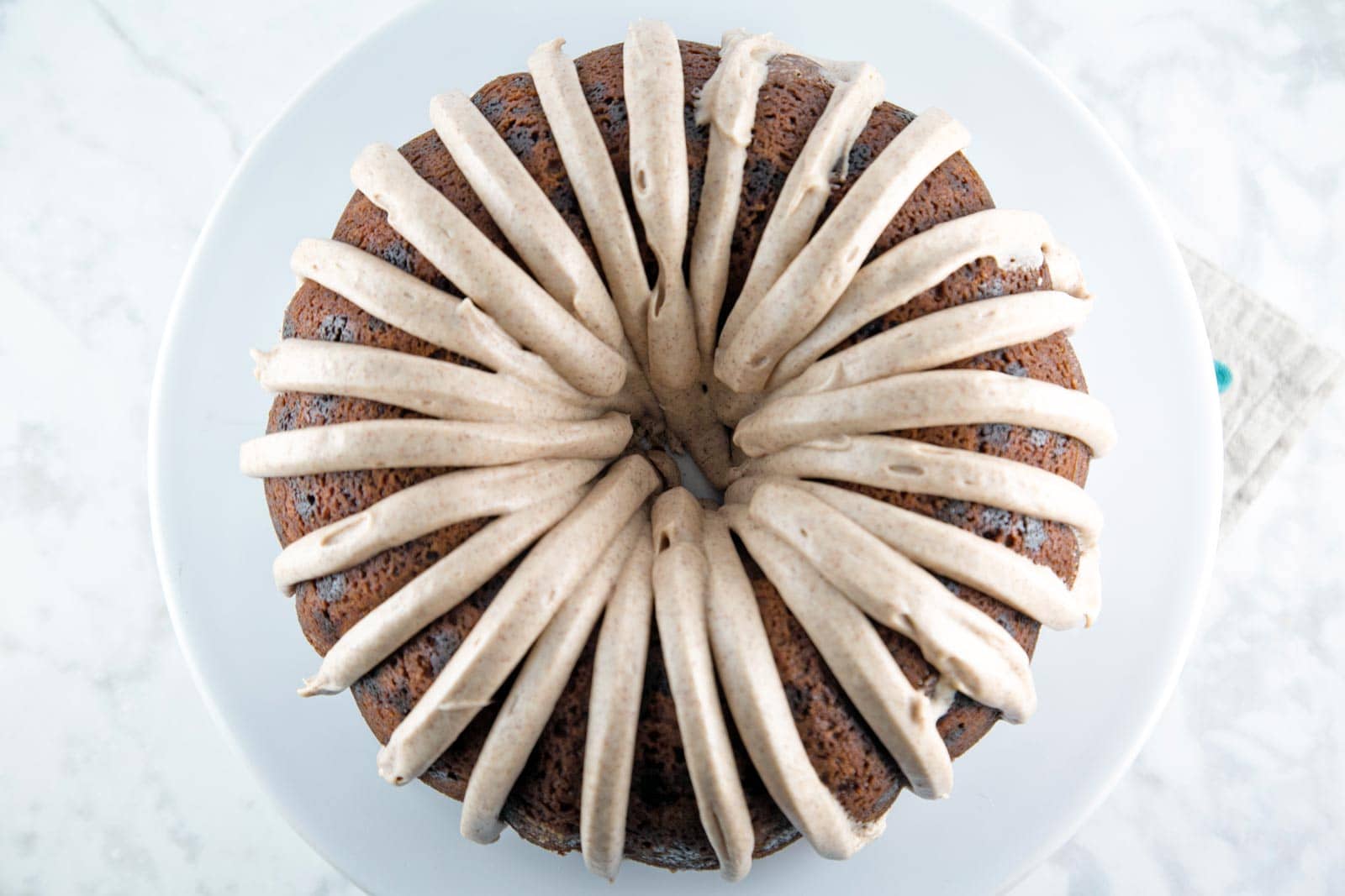 Cinnamon Swirl Bundt Cake: one bowl, whisk by hand, with cinnamon cream cheese frosting. Plus tips for the BEST cake from a boxed cake mix! {Bunsen Burner Bakery}